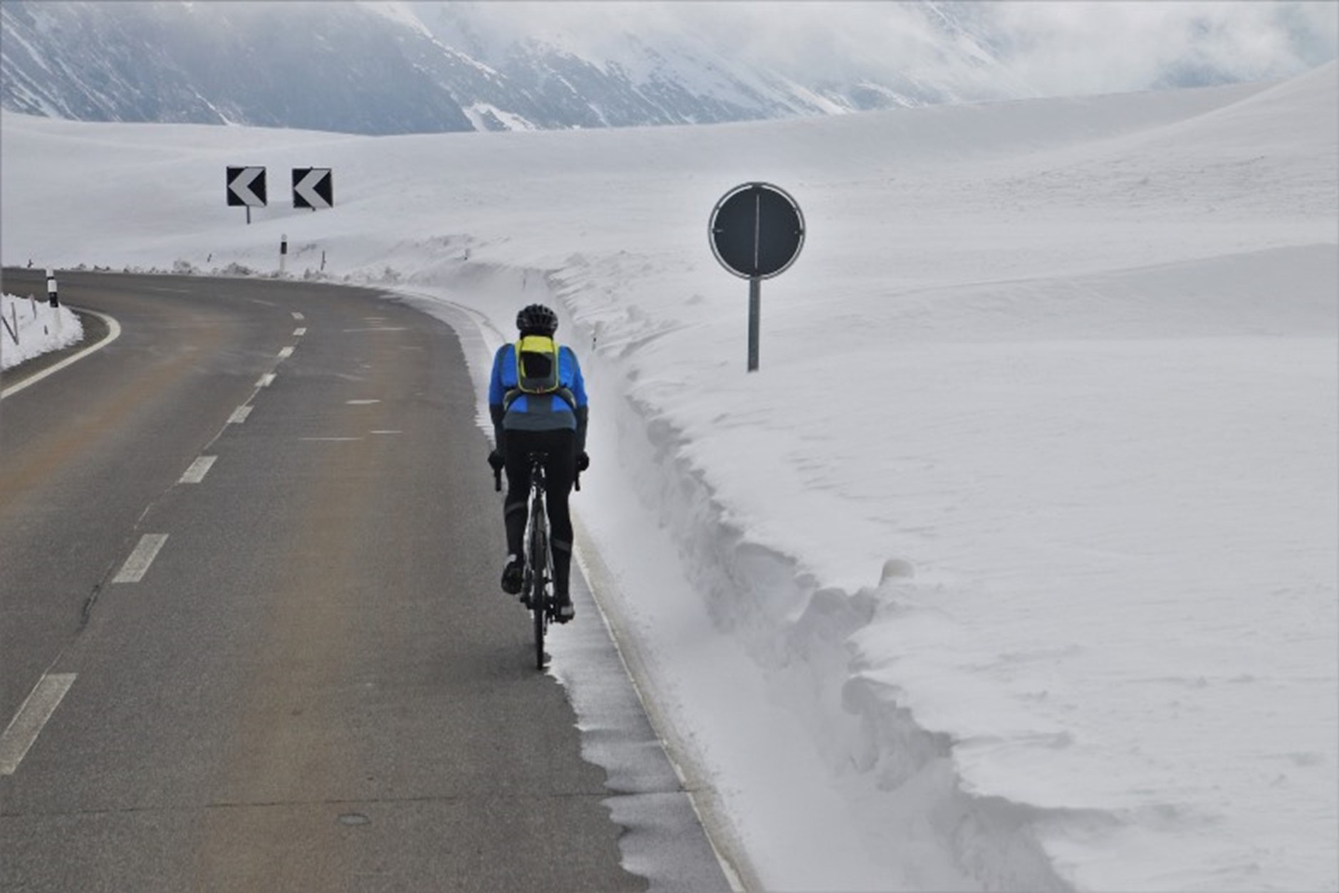 Bike Path bicyclist in winter snow roadway